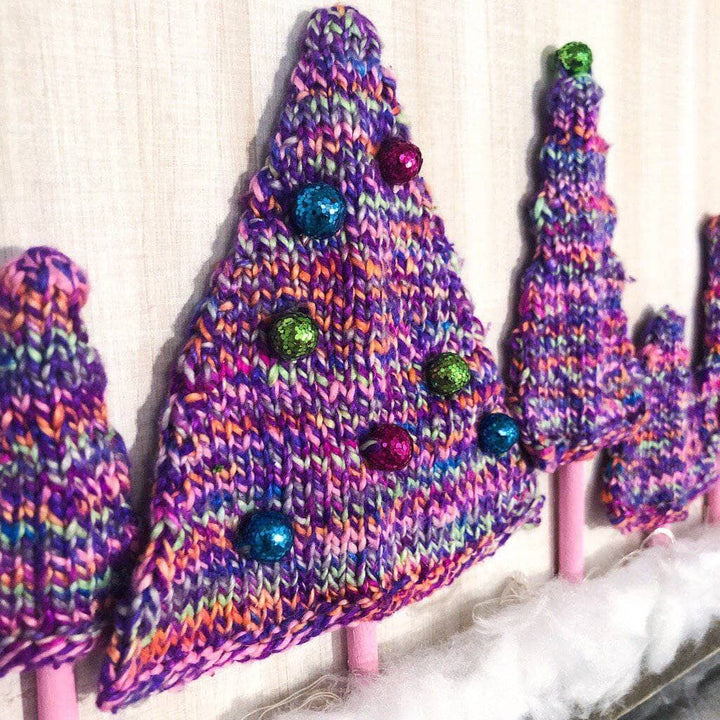 Purple yarn trees on a white background