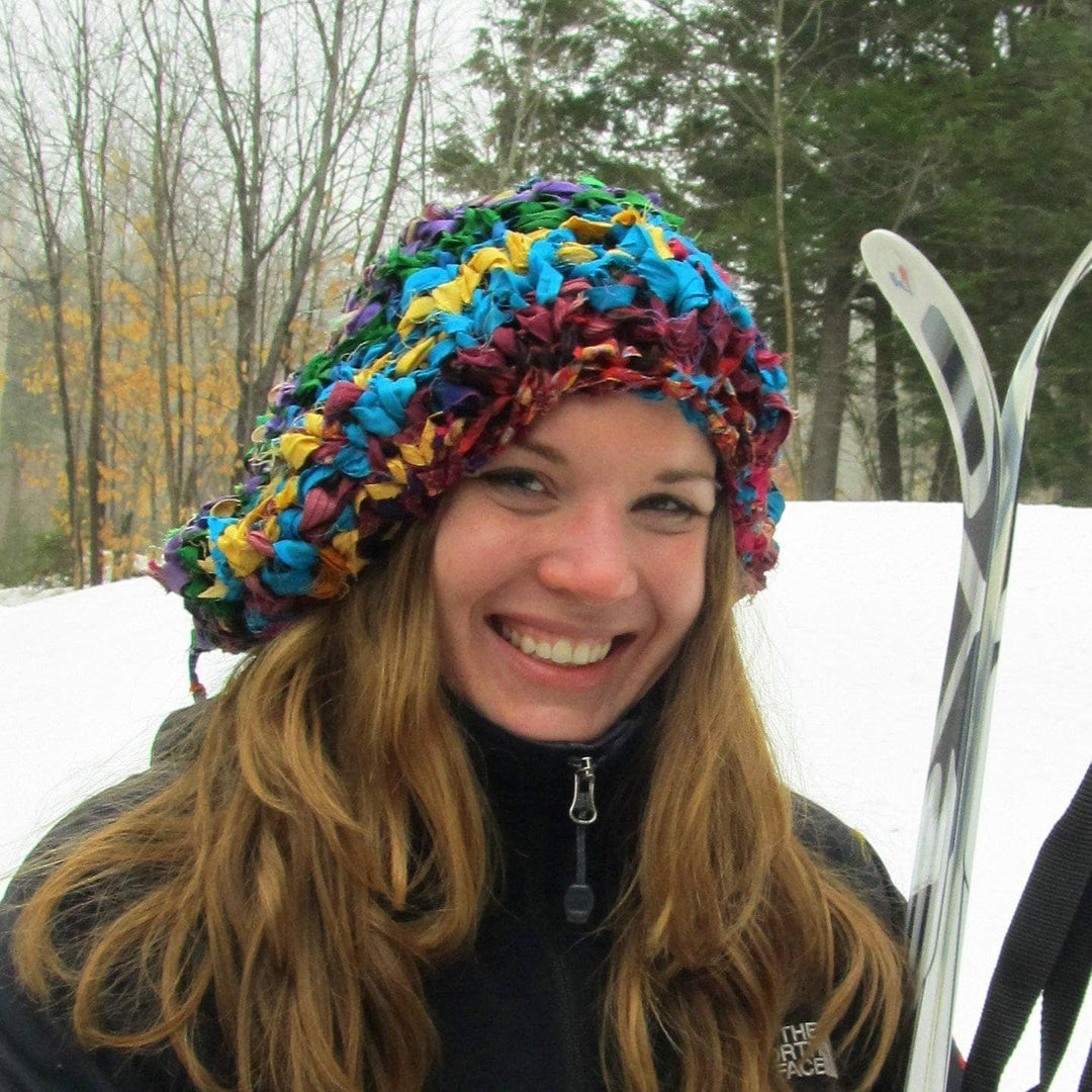 woman wearing a colorful beanie and smiling