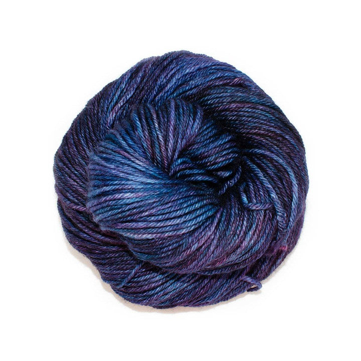 A skein of variegated purple yarn on a white background