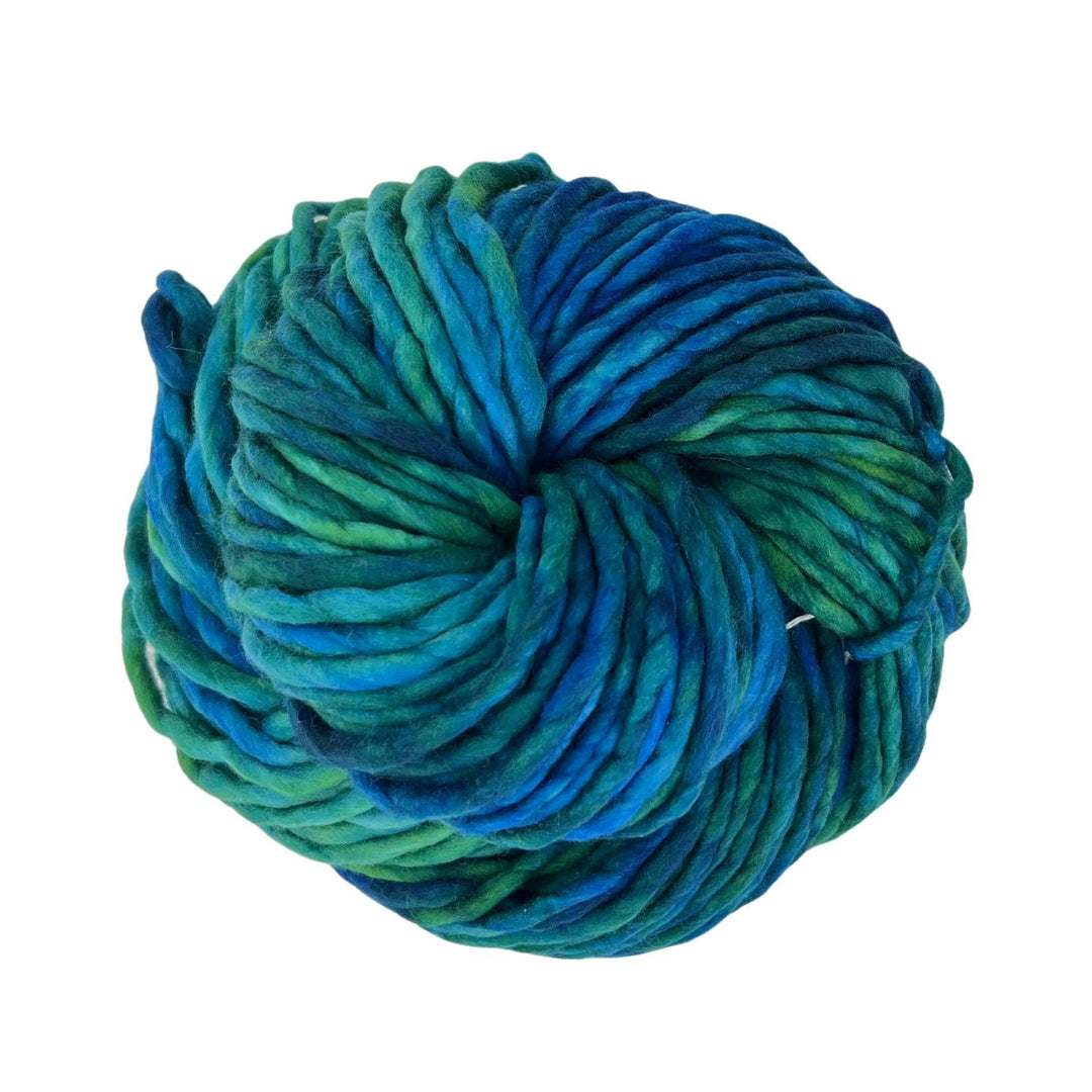 tonal blue and green single ply wool yarn in front of a white background.