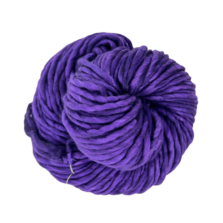 tonal purple single ply wool yarn in front of a white background.