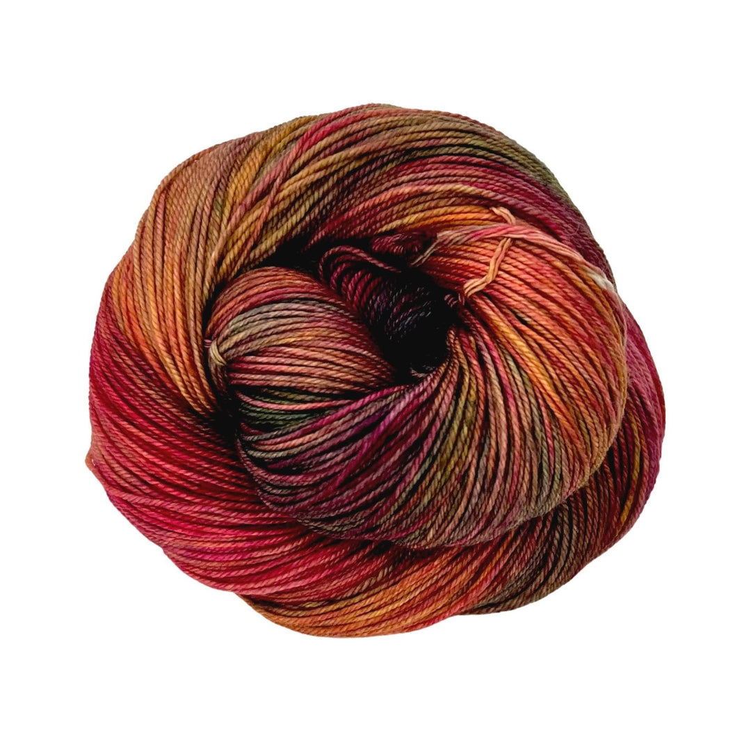close up of yarn in the color diana (red, orange, and yellow)