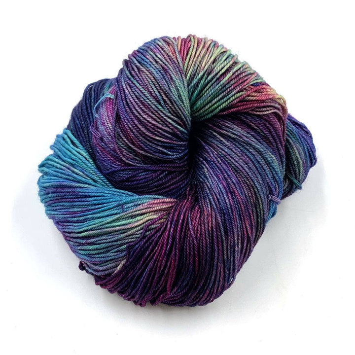 close up of yarn in the color fortaleza (teal, purple, and blue)