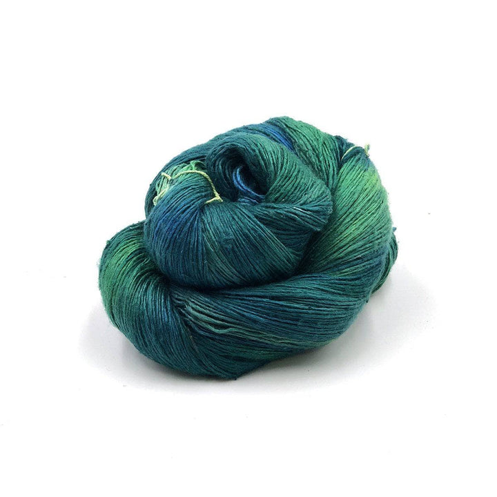 a skein of blue and green yarn on a white background