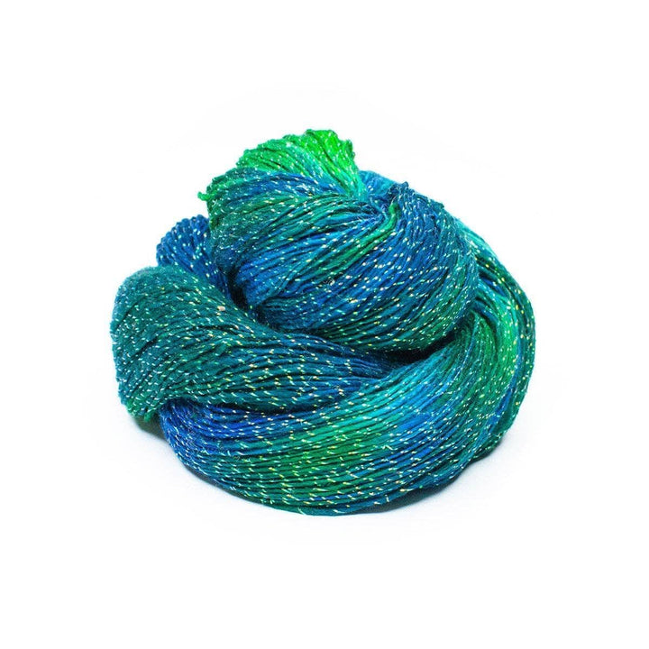 a skein of blue and green sparkle yarn on a white background