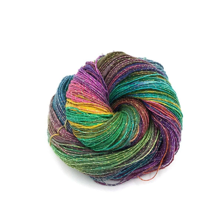 a skein of multicolored sparkle yarn on a white background