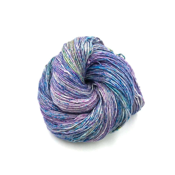 a skein of blue and purple yarn on a white background