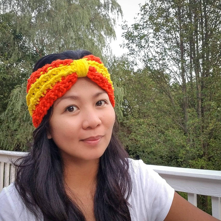 women wearing a yellow and orange headband outside