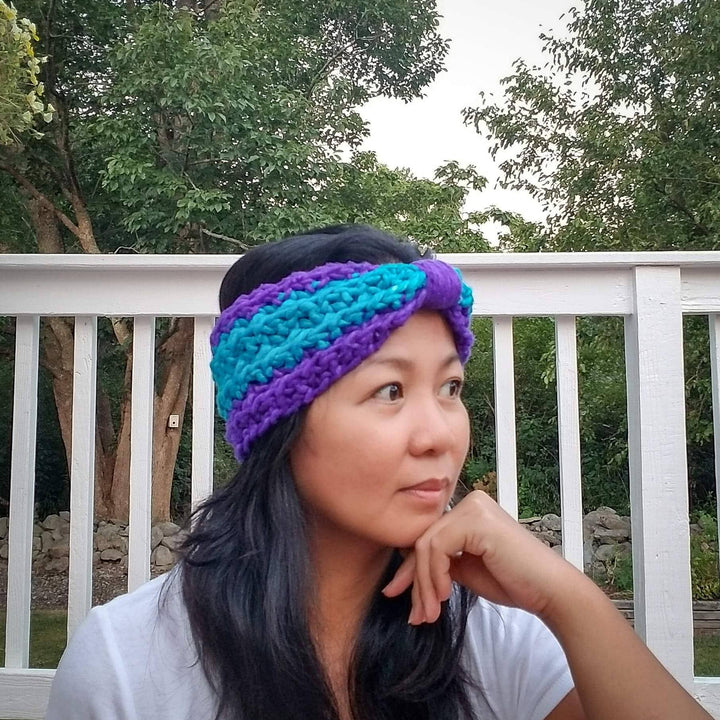 women wearing a blue and purple headband outside