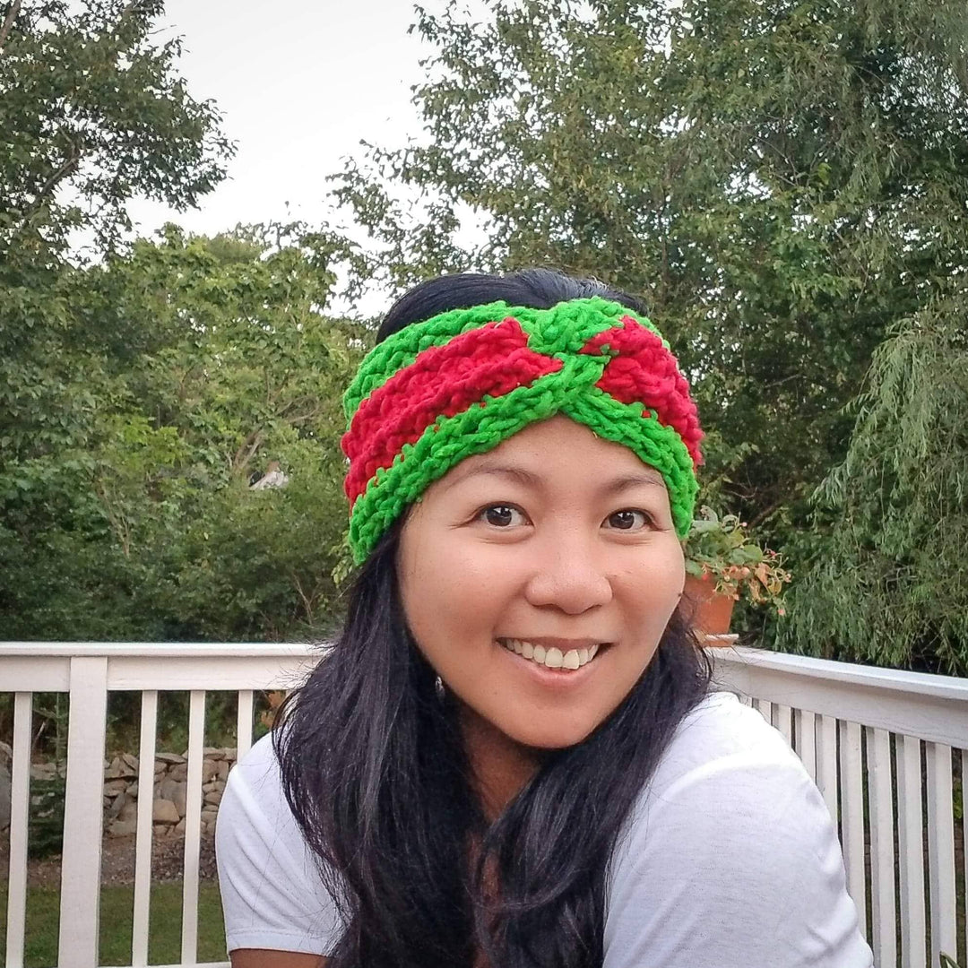 women wearing a green and red headband outside