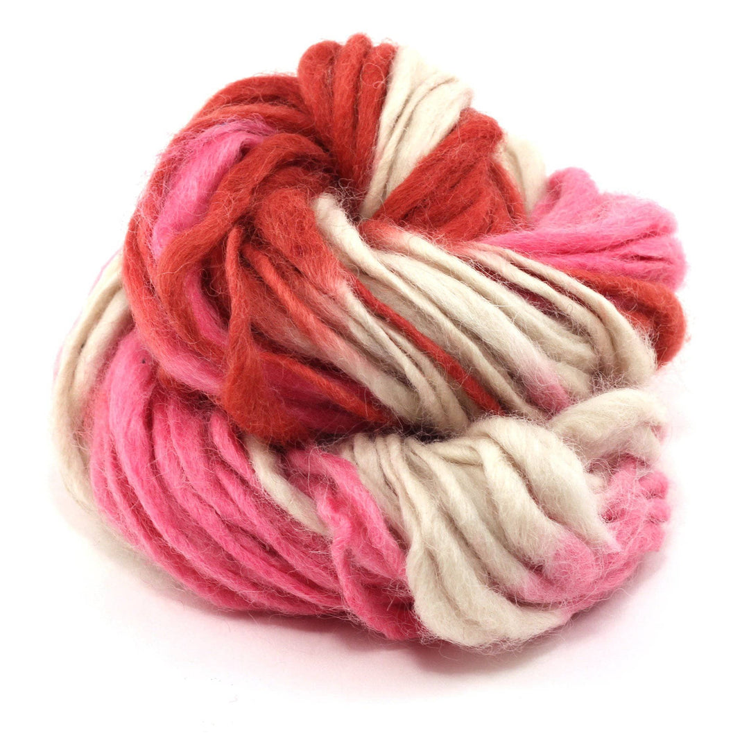 cake of yarn in the color love letter (pink and white) with a white background