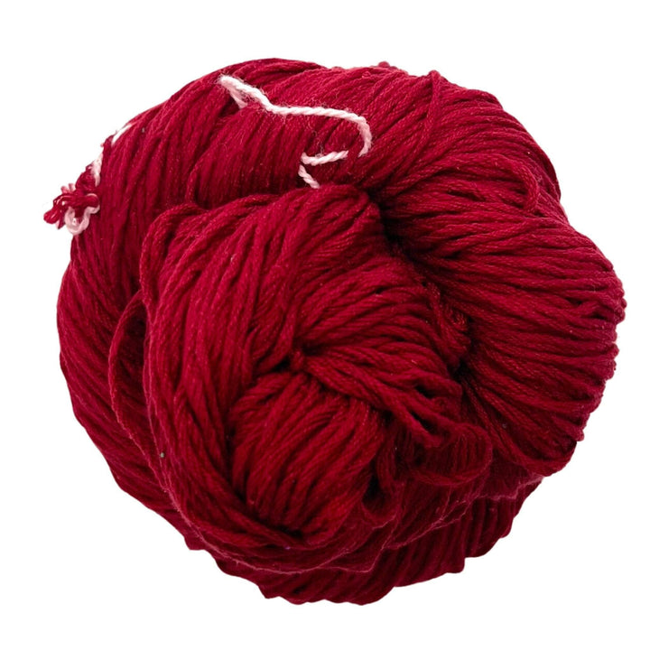 A skein of Mulberry silk fingering yarn in the colorway 'true red' on a white background.