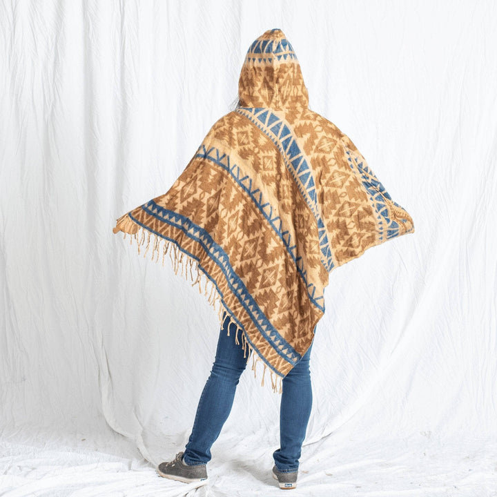 girl wearing Nanda Hooded Poncho on a white background