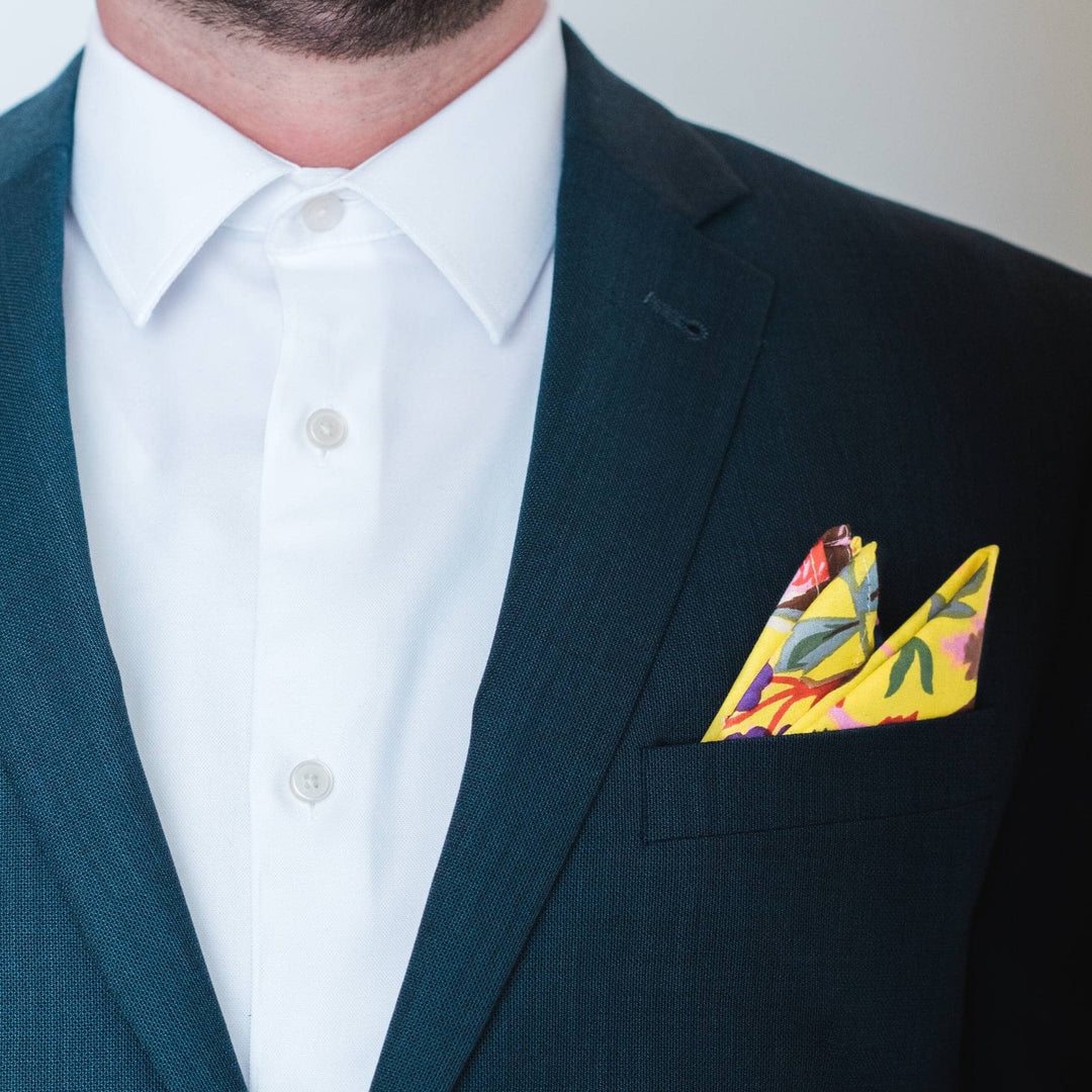 closeup of yellow pocket square in a suit jacket. 