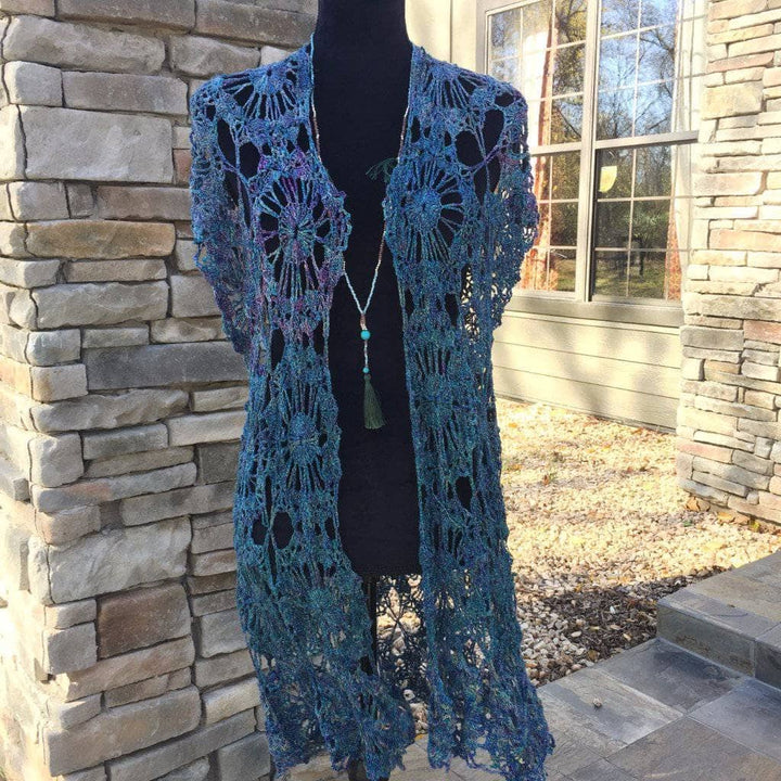 blue poncho over a mannequin outdoors