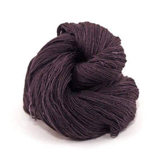 black lace weight silk yarn on a white background