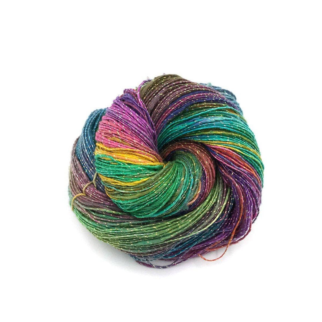 cake of yarn in the color exotic watercolors (multicolor) with a white background