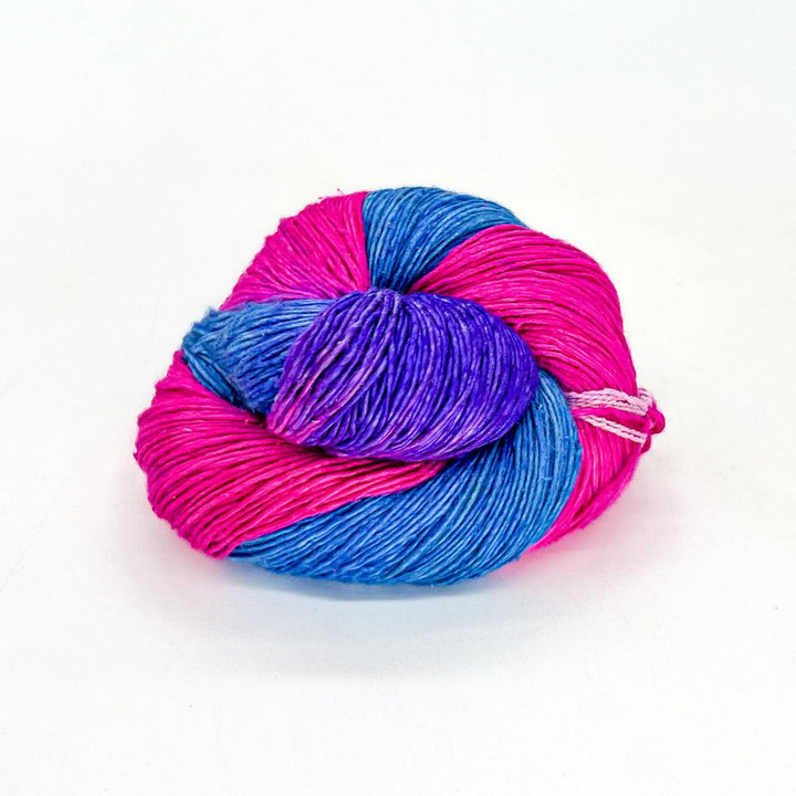 Close up image of sport weight hand dyed pride themed yarn bisexual pride flag colors.