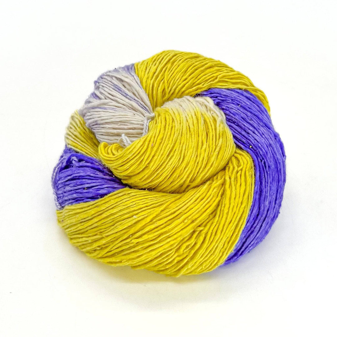 Close up image of sport weight hand dyed pride themed yarn nonbinary pride flag colors.