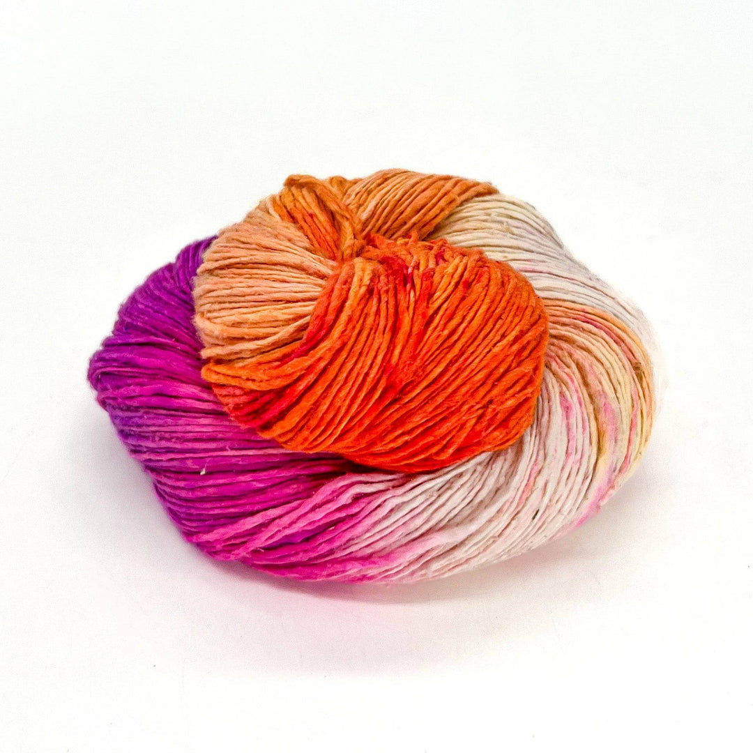 Close up image of sport weight hand dyed pride themed yarn lesbian pride flag colors.