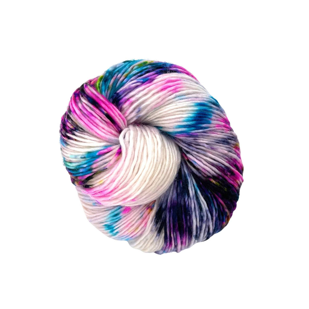 A skein of pure sport weight merino wool yarn with speckled purple, pink and blue on a white background