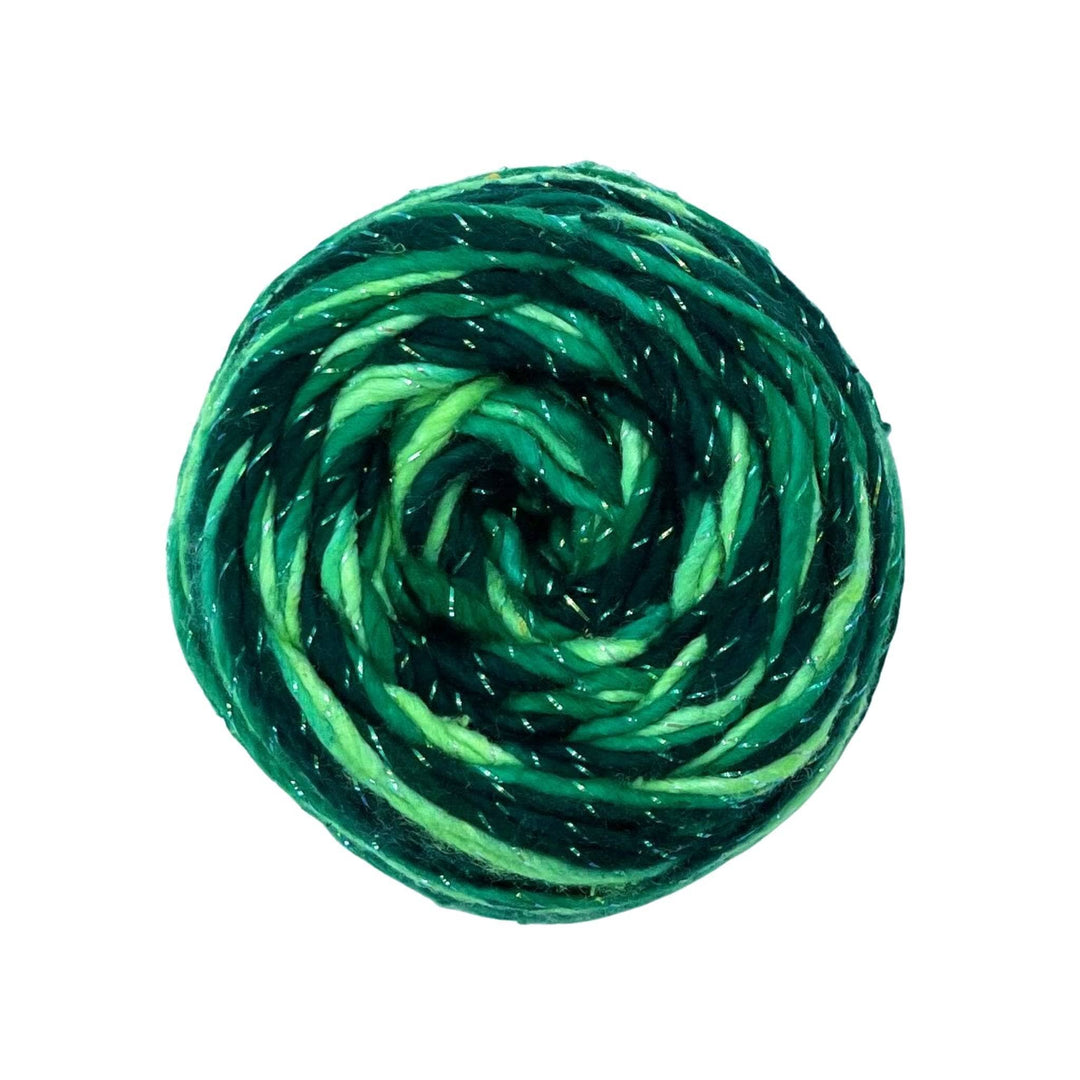 A skein of 4 shades of green and sparkle on a white background