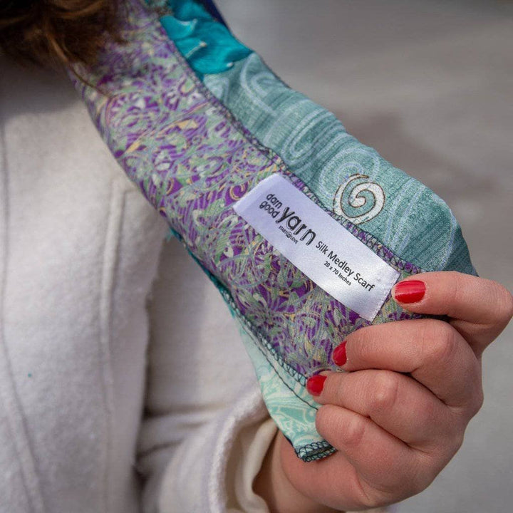 hand holding a sari medley scarf with tag