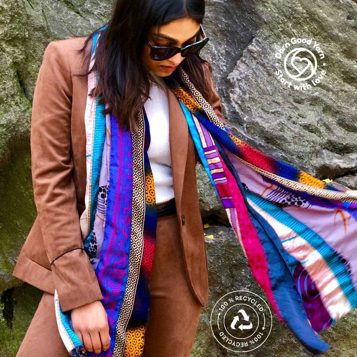 woman wearing sari medley scarf with darn good yarn logo