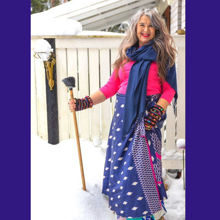 woman wearing navy and magenta sari wrap skirt in the snow