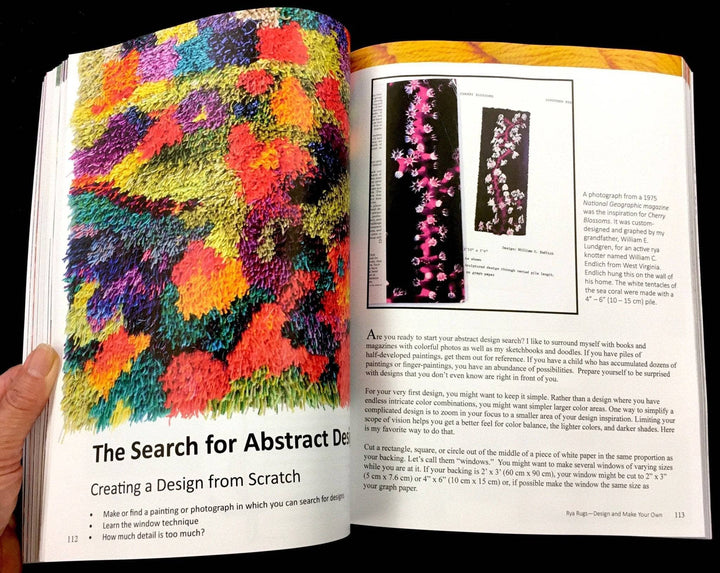 Rya Rugs book opened to page 112-113. Page 112 features a 3/4 of the page photo of a bright multicolored rug with abstract shapes along with the heading "The search for Abstract Design." Page 113 features a photograph of pink and white sea coral which is described to be the inspiration for the rug "Cherry Blossoms," followed by 1/2 page of text.