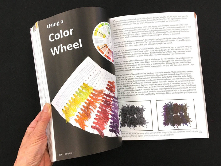 The Rya Rugs book opened to page 150-151. The section heading on page 150 reads "Using a Color Wheel" along with a full page pgotograph of a color wheel and yarn color sample cards in yellow, orange, red, and purple. Page 151 is filled with text as well as two small photos of different colored yarns.