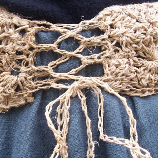 Close up picture of a hemp lace belt on a blue skirt 