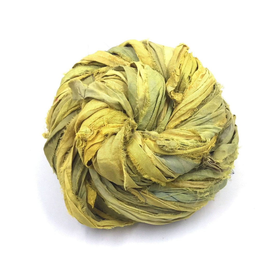 yellow cake of yarn in a white background