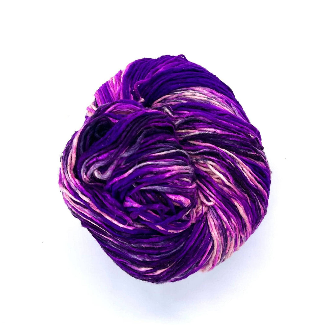 Violet, Purple, Lilac, and white Worsted weight yarn on a white background