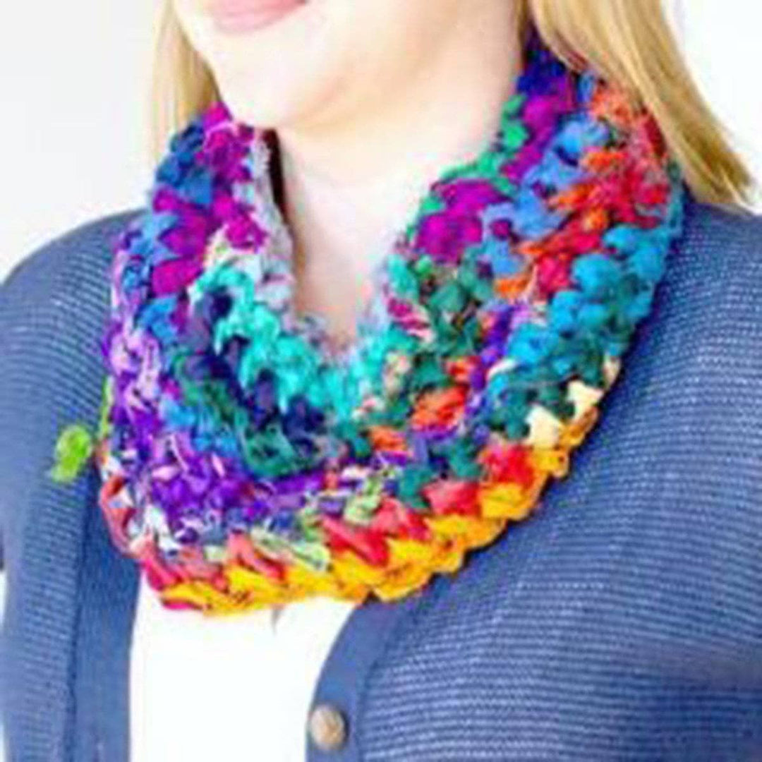 close up of a woman wearing a colorful scarf