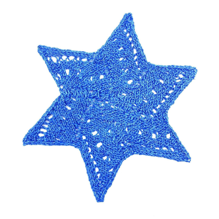 knit blue linen star using lace stitches in front of a white background.