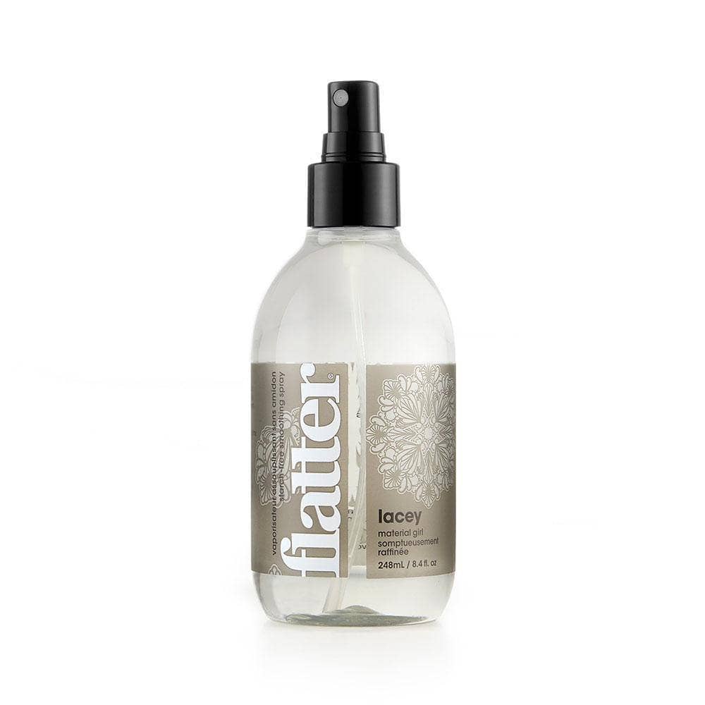 bottle of SOAK Flatter Fabric Spray over a white background