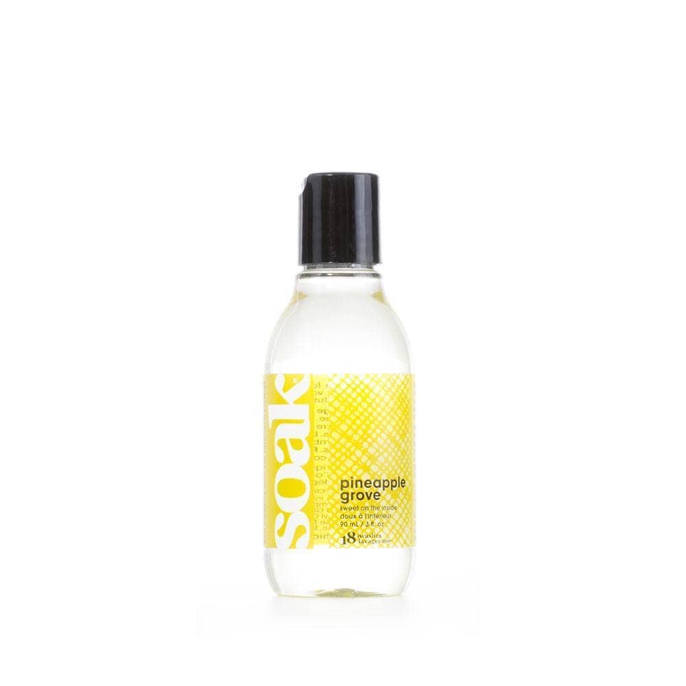 close up of  SOAK Wash Laundry Soap (pineapple grove) with a white background