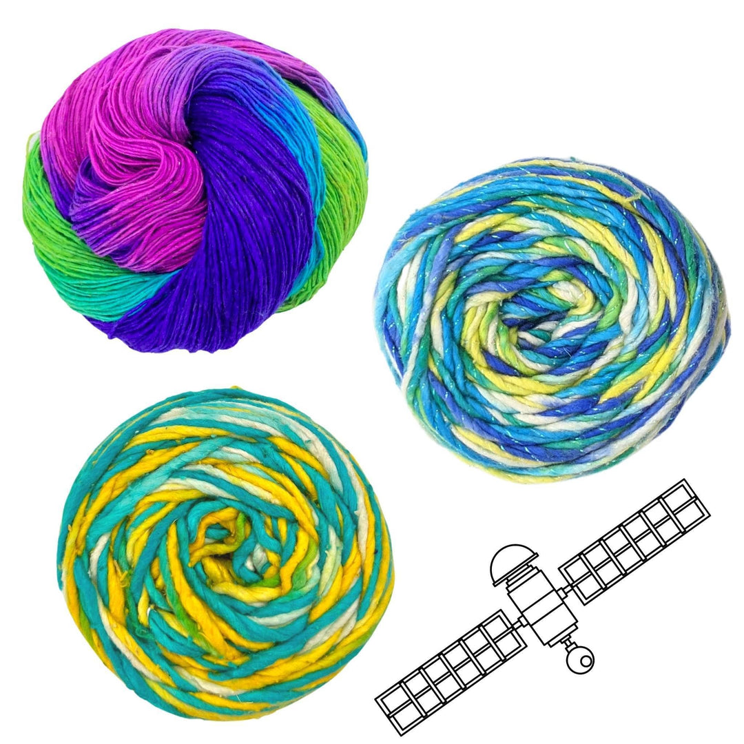 earth solar system yarn pack in front of a white background with black graphic in lower right. Lace weight silk vibrant peacock, sparkle worsted weight stars in the night sky, and silk roving worsted weight ocean light.