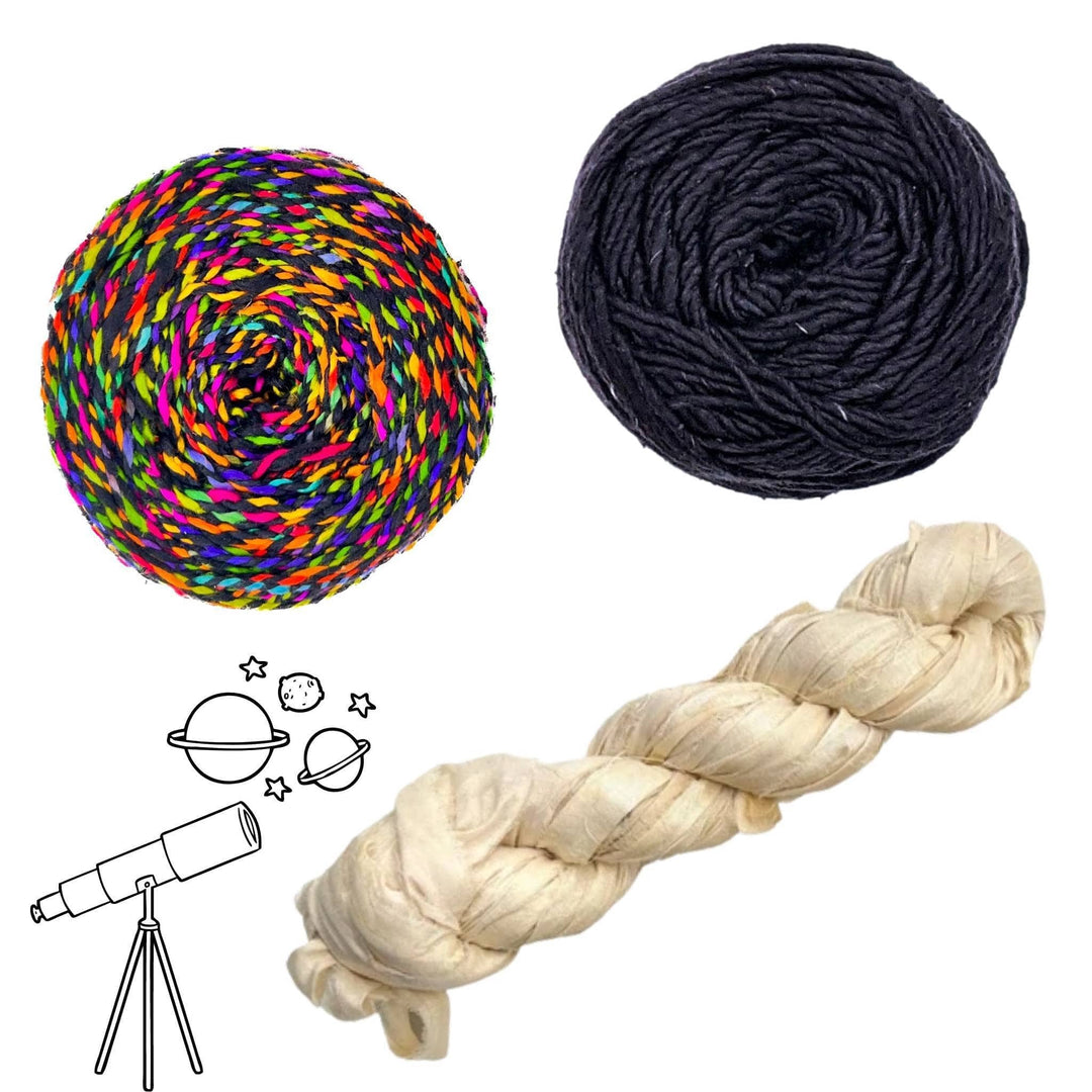 Earth's moon solar system yarn pack in front of a white background with black graphic in lower left. Darn Good Twist Black Rainbow, silk roving worsted weight black, and sari silk ribbon yarn vintage ivory.
