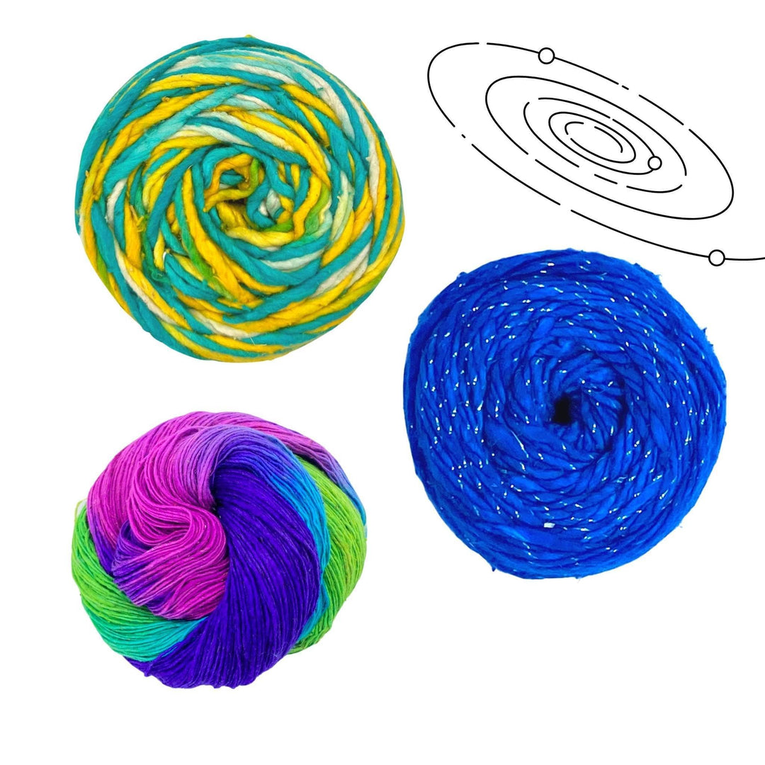 Uranus solar system yarn pack in front of a white background with black graphic in upper right. Sparkle worsted weight silk classic blue, silk roving worsted weight ocean light and lace weight silk vibrant peacock