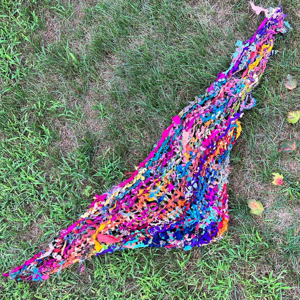 Sparkle Me Shawl spread out laying on top pf green grass