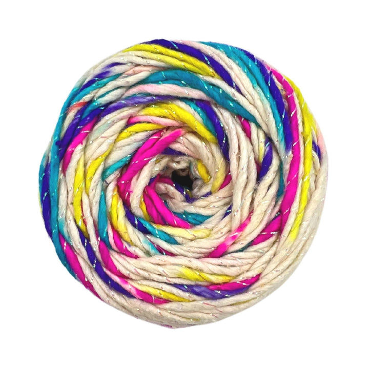 Skein of sparkle worsted weight silk in birthday cake colorway celebration yarn, white and multicolor variegated.