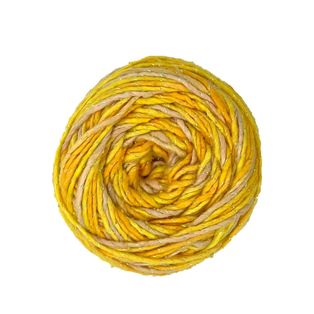 A skein of 3 shades of yellow and sparkle on a white background