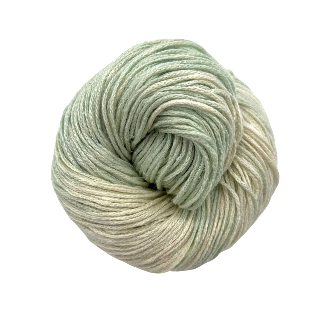 Very pale sea form green with cream colored yarn on white background