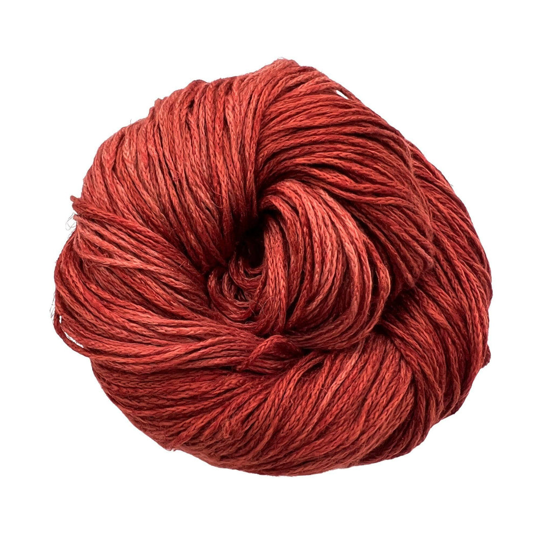 Deep red yarn on white background