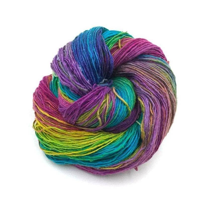 rainbow colored yarn on a white background