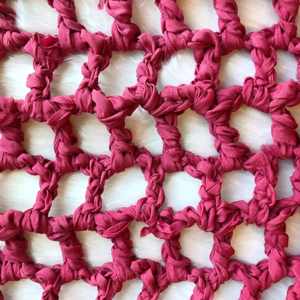 Close up of the summer Nights Chiffon Crochet Shawl on a white background