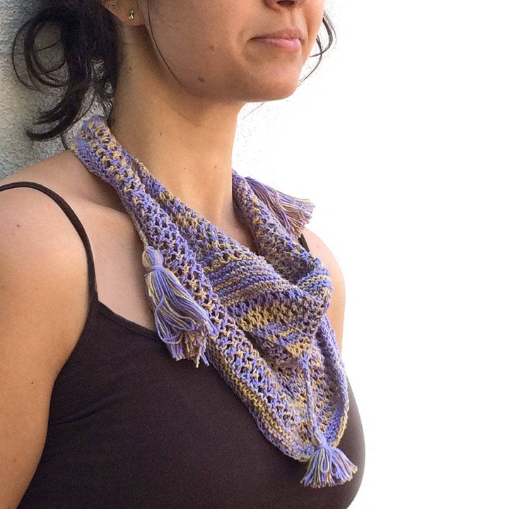 Woman wearing the Summer's Breeze Shawlette in front of a white background