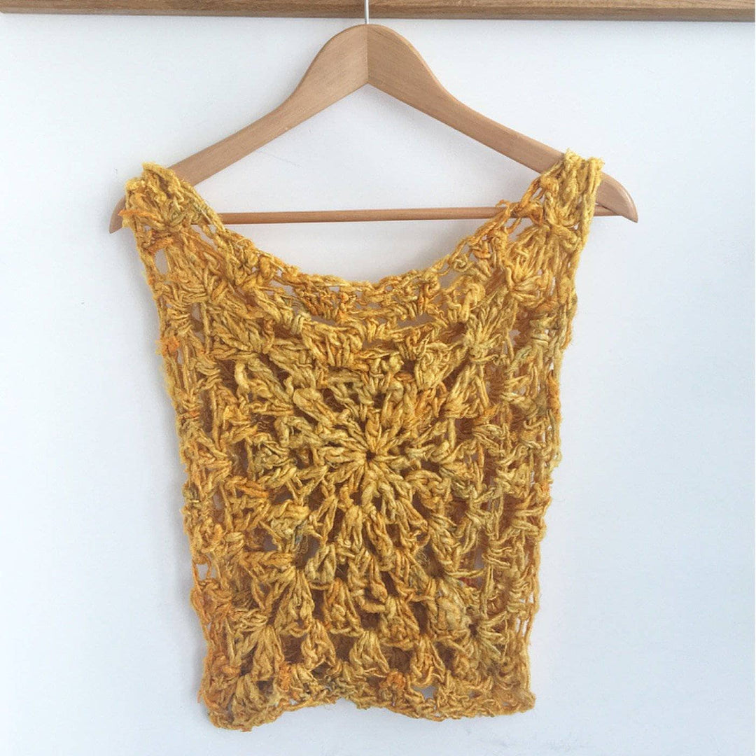 Sunny Days Tank Top in Sunflower (yellow) hanging in front of a white wall